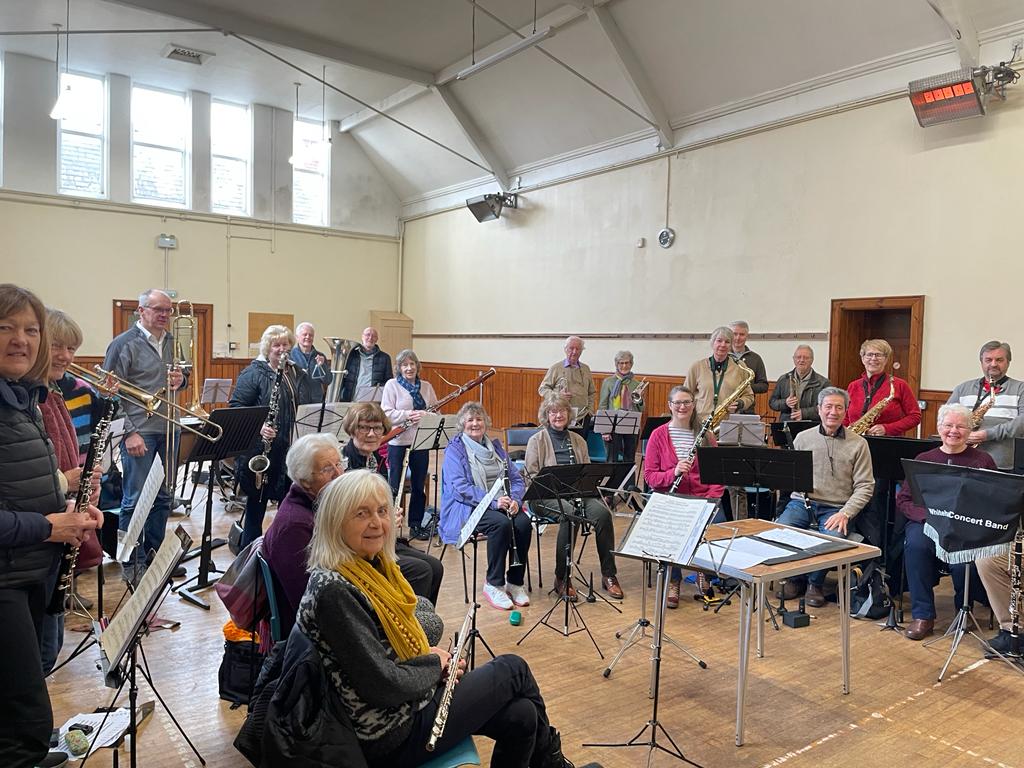 A group shot of the band during rehearsal.