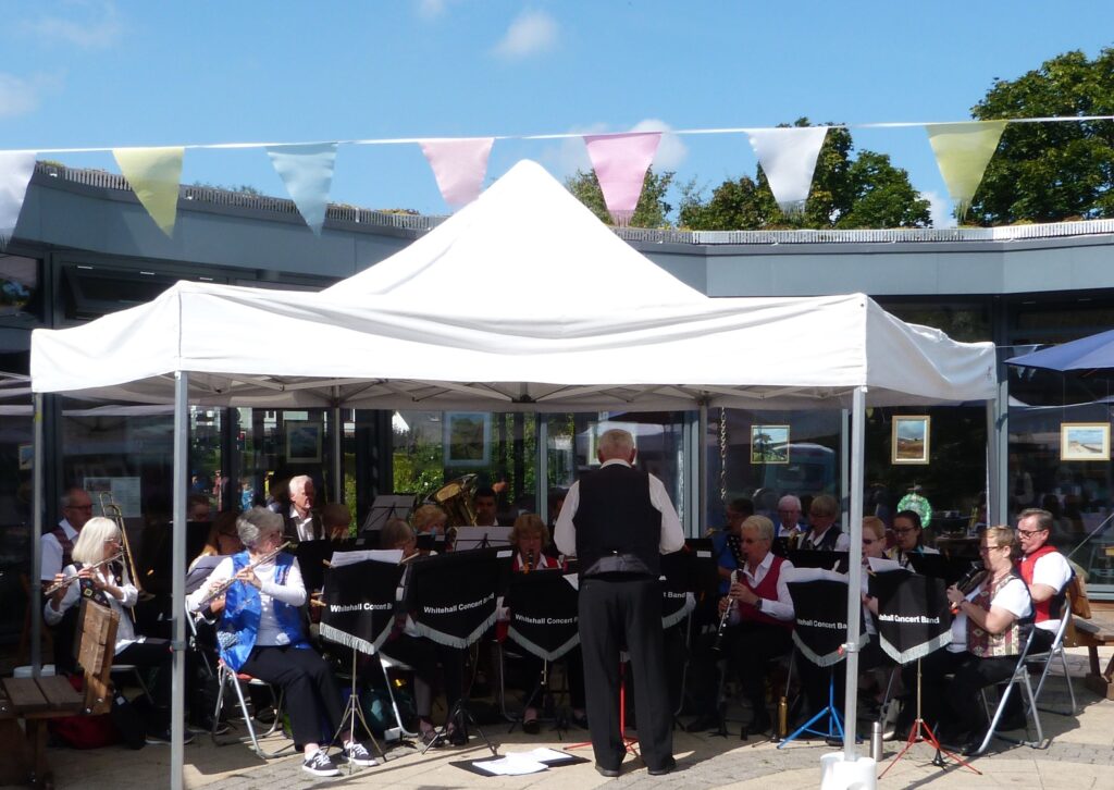 full band under gazebo at Land of Oak and Iron.