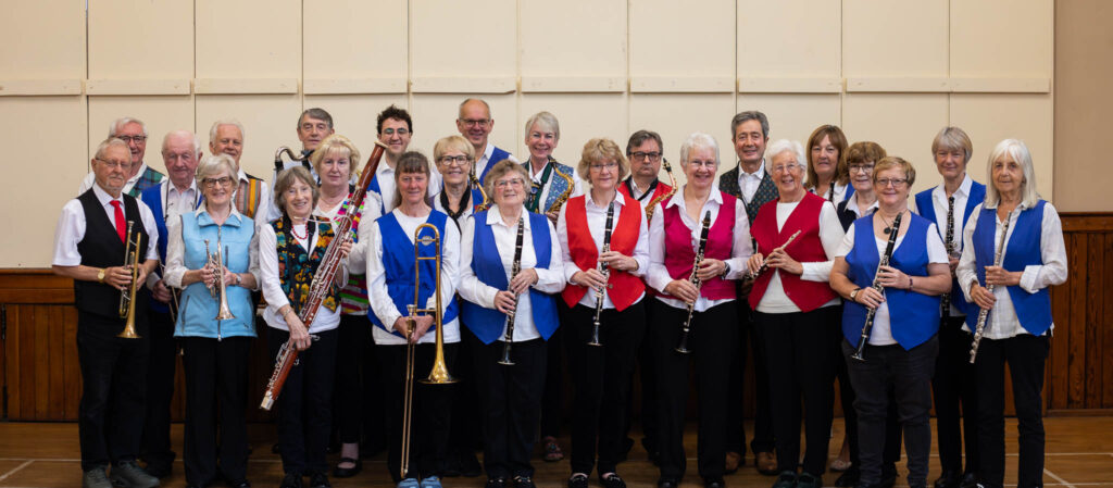 Full Band Standing in Rehearsal Hall